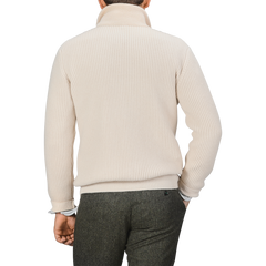 A person wearing a G.R.P Ecru Beige Wool Cashmere Knitted Jacket, paired with dark gray trousers, viewed from the back.