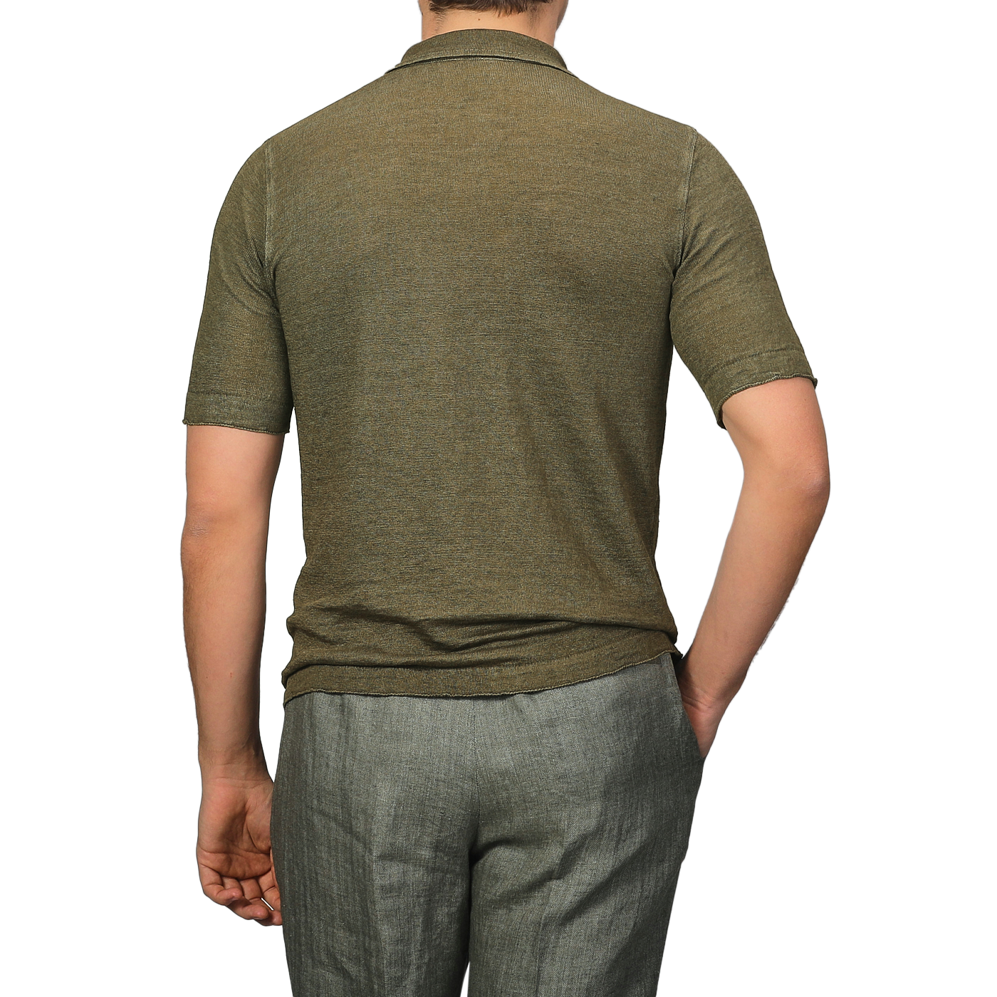 A man in a G.R.P Military Green Linen Polo Shirt and gray pants stands facing away from the camera against a plain background.