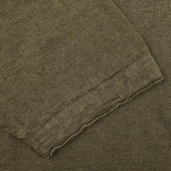 Close-up of the G.R.P Military Green Linen Polo Shirt's textured fabric, featuring a detailed weave pattern and an elegant seam along the edge.