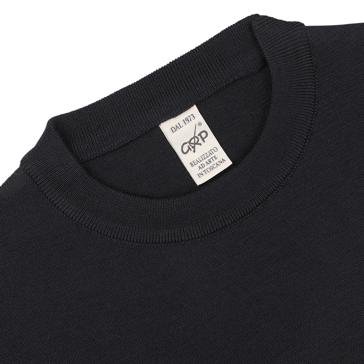 Close-up of the neckline and label of the Night Blue Wool Crewneck Sweater by G.R.P. The label reads "DAL 1973" and indicates it is made in Italy from pure merino wool.