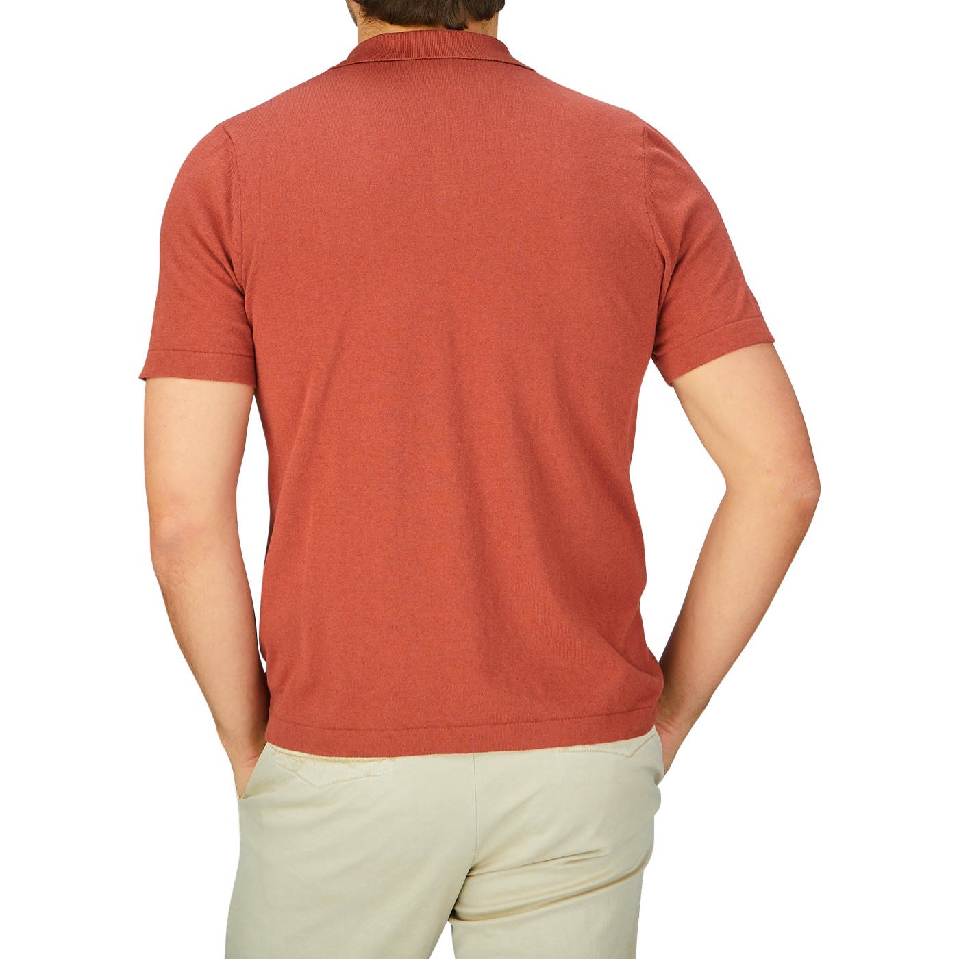 The back view of a man wearing a G.R.P rust red cotton linen slim fit polo shirt.