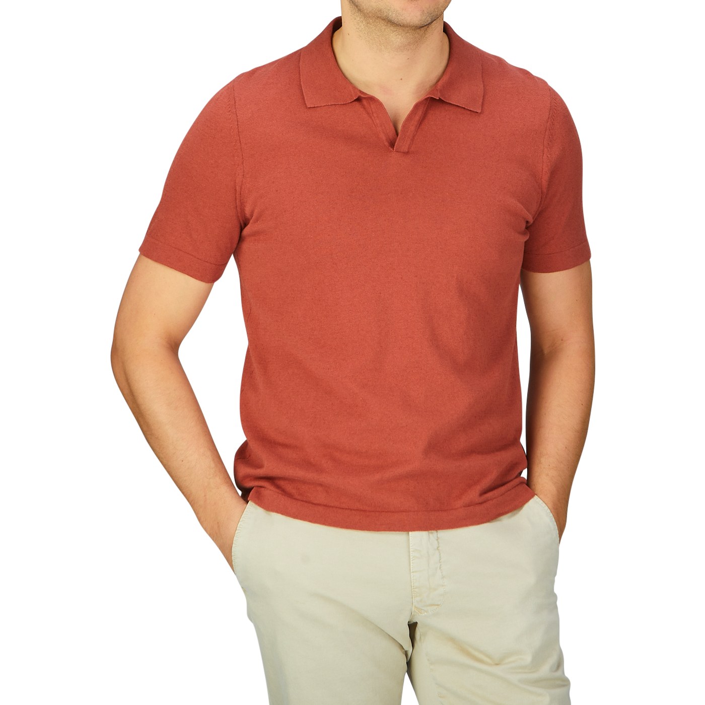 A man wearing a G.R.P rust red cotton linen polo shirt and khaki pants.