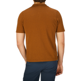 The back view of a man wearing a brown, slim fit G.R.P Tobacco Cotton Linen Polo Shirt.