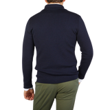 The back view of a man wearing a G.R.P Navy Blue Merino Wool Zip Jacket.