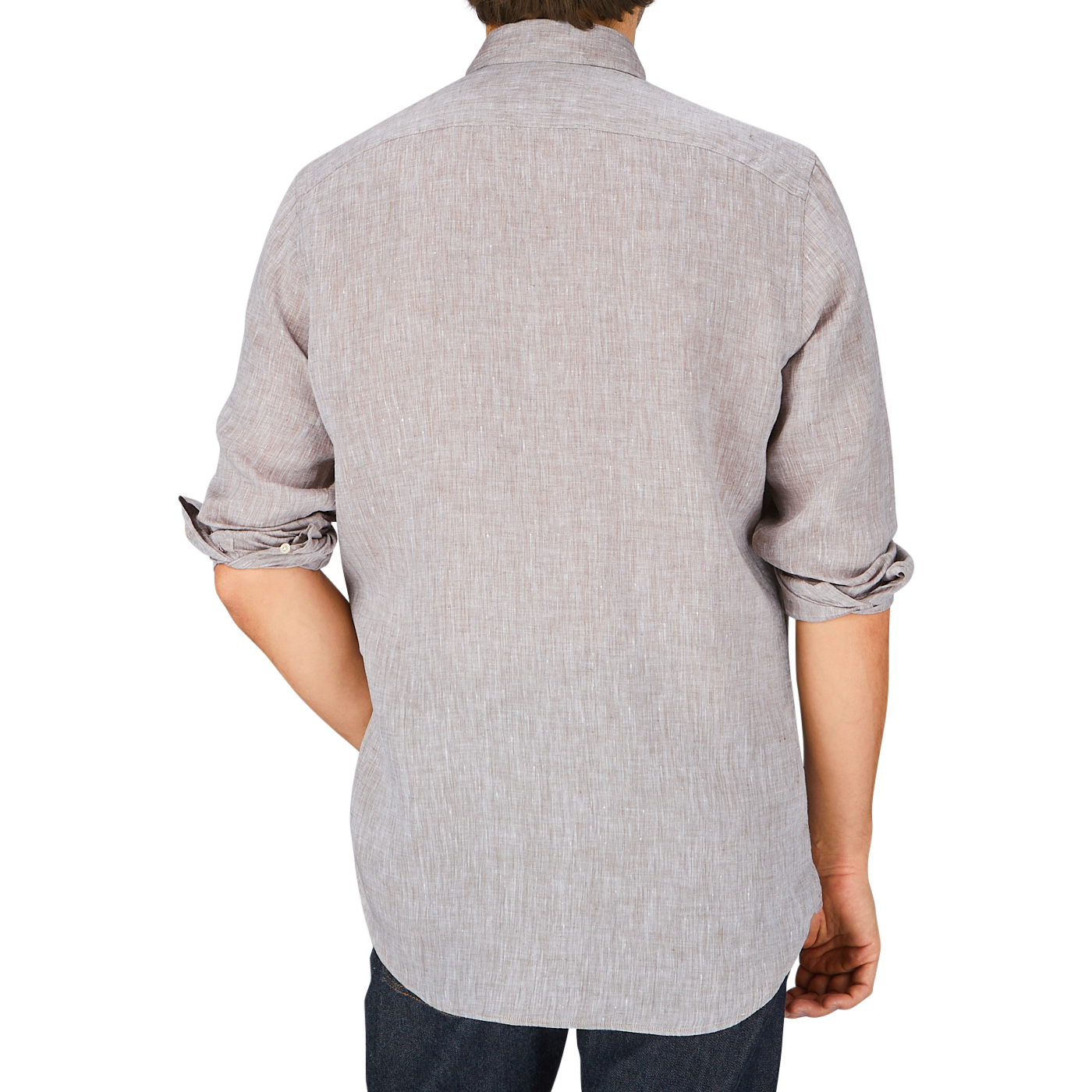 Man wearing a Glanshirt brown melange linen regular fit shirt, rolled-up sleeve and jeans, viewed from behind.
