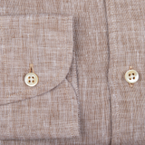 Close-up of a Glanshirt Brown Melange Linen Regular Fit Shirt with two buttons on a garment.