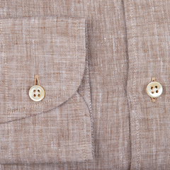 Close-up of a Brown Melange Linen Regular Shirt by Glanshirt with two beige buttons and a pocket flap.