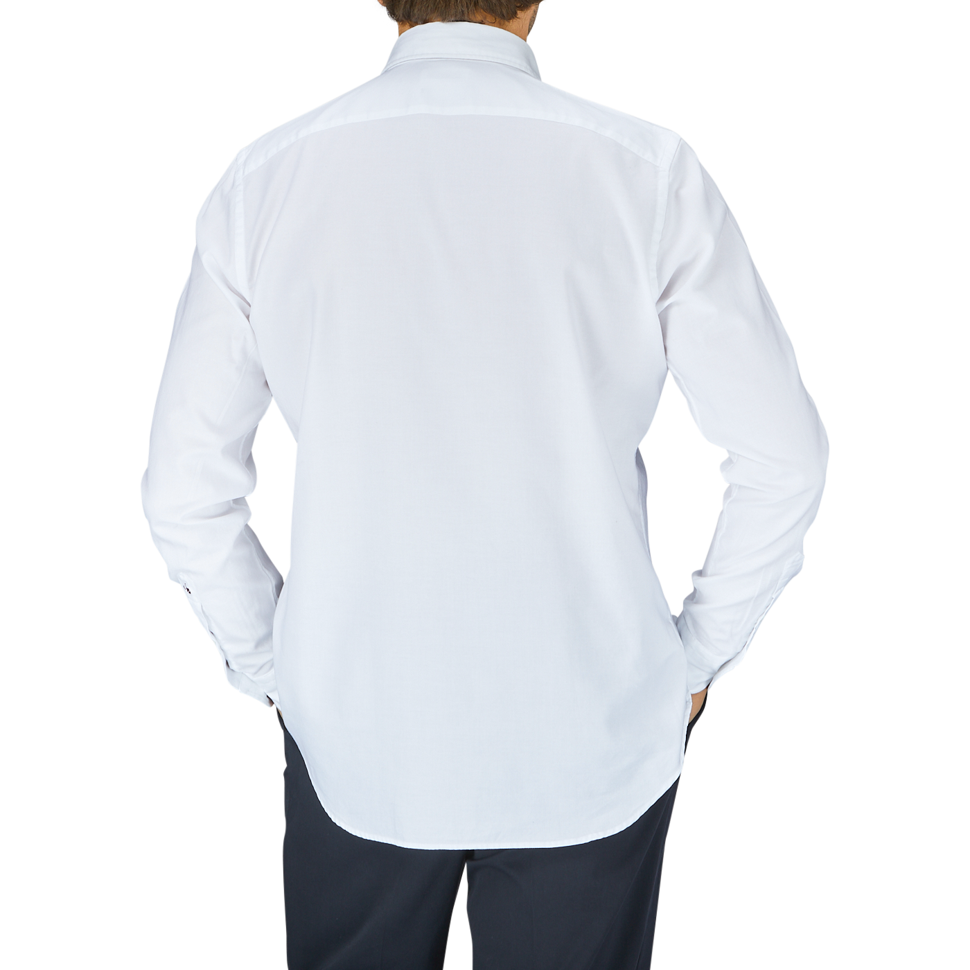 A person standing with their back to the camera, wearing a Glanshirt White Cotton Oxford Regular Shirt with mother-of-pearl buttons and black pants.
