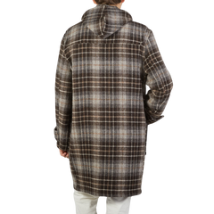 A contemporary take on a man wearing the De Bonne Facture Brown Undyed Shepherds Check Wool Duffle Coat.