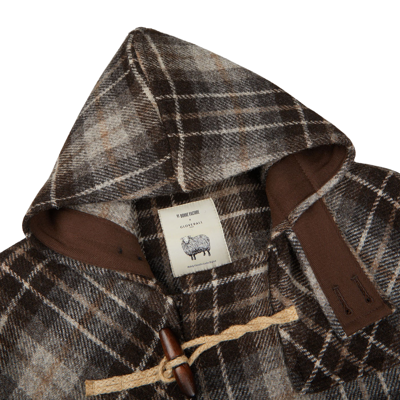 A brown undyed Shepherds Check wool Monty Duffle coat with a hood from De Bonne Facture.