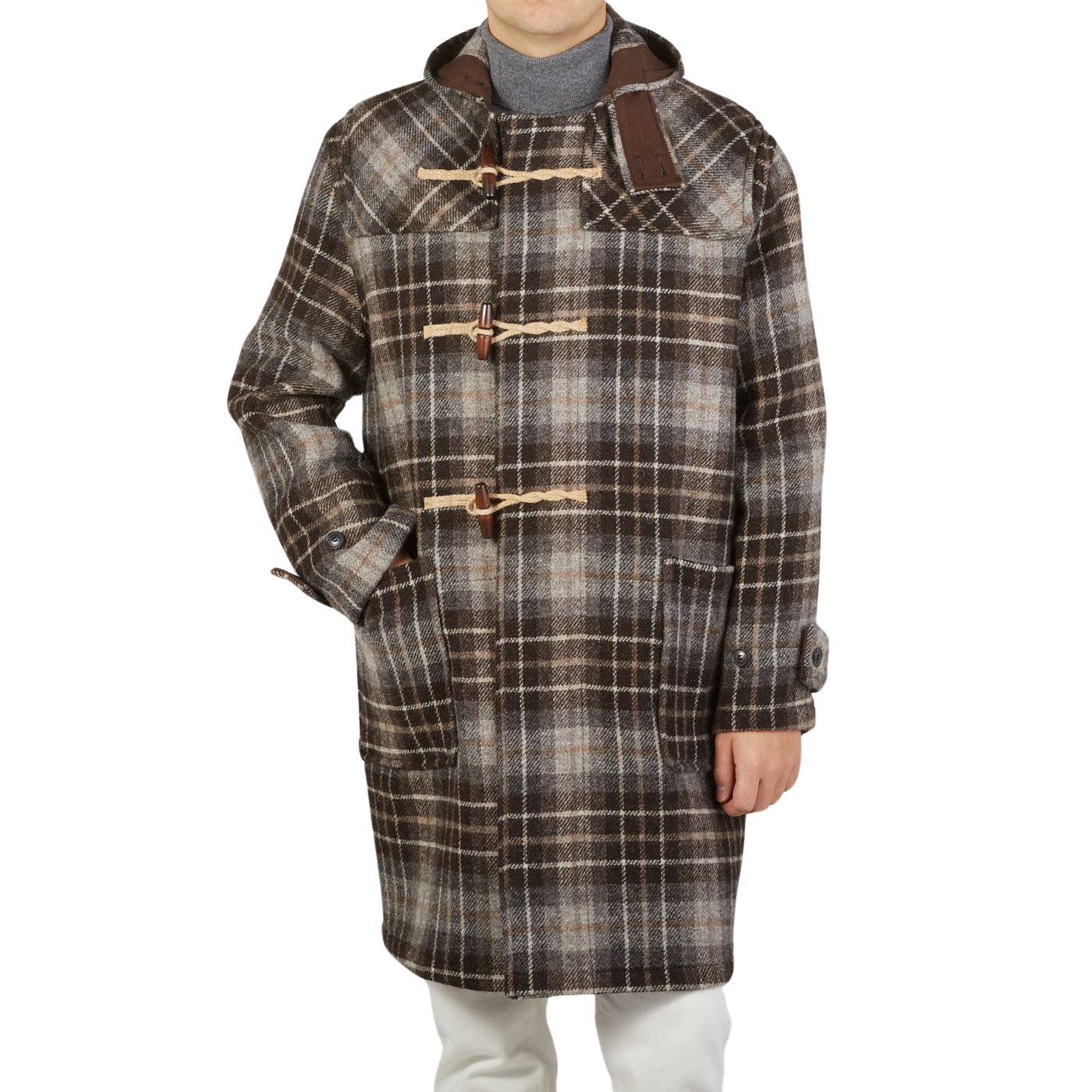 A man wearing a contemporary take on the De Bonne Facture Brown Undyed Shepherds Check Wool Duffle coat.