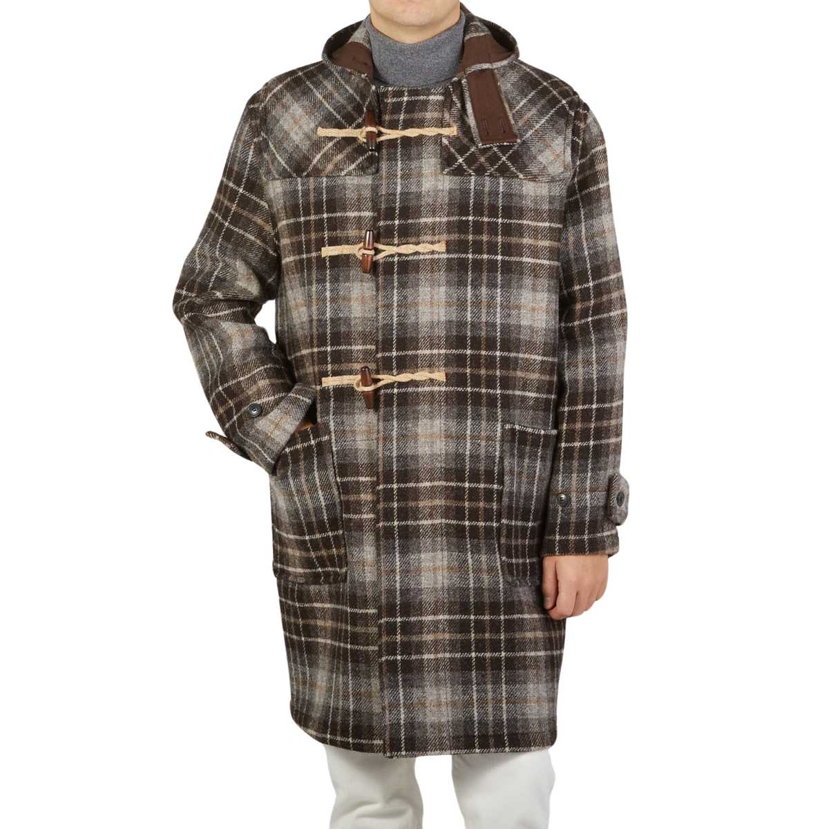 A man wearing a contemporary take on the De Bonne Facture Brown Undyed Shepherds Check Wool Duffle coat.