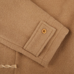 A close up of a Camel Wool Monty Duffel Coat with buttons made by Gloverall.