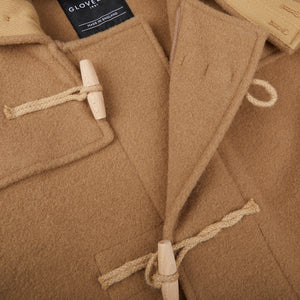 A close up image of a Gloverall Camel Wool Monty Duffel Coat.