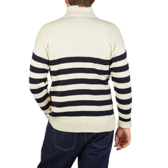 The back view of a man wearing an Ecru Blue Striped Wool Rollneck sweater by Gloverall.