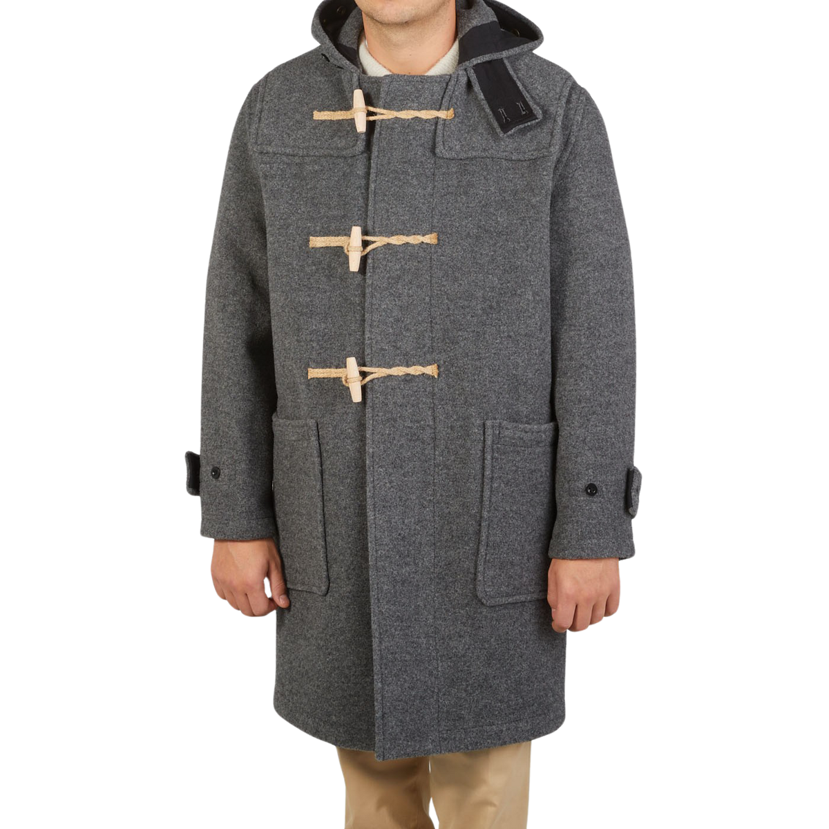 A young explorer sporting a Gloverall Grey Melange Wool Monty Duffle Coat.