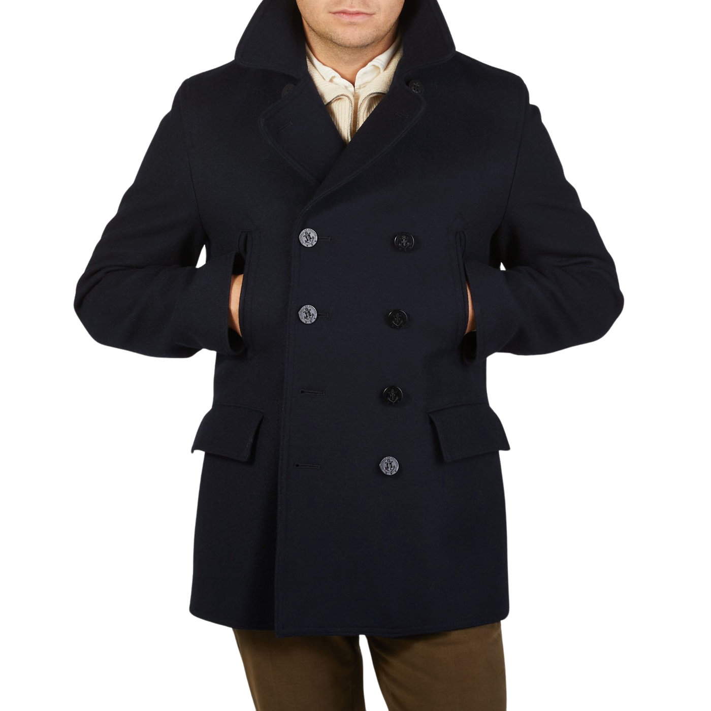 A man wearing a navy Gloverall Navy Wool Churchill Peacoat made of English Melton wool.