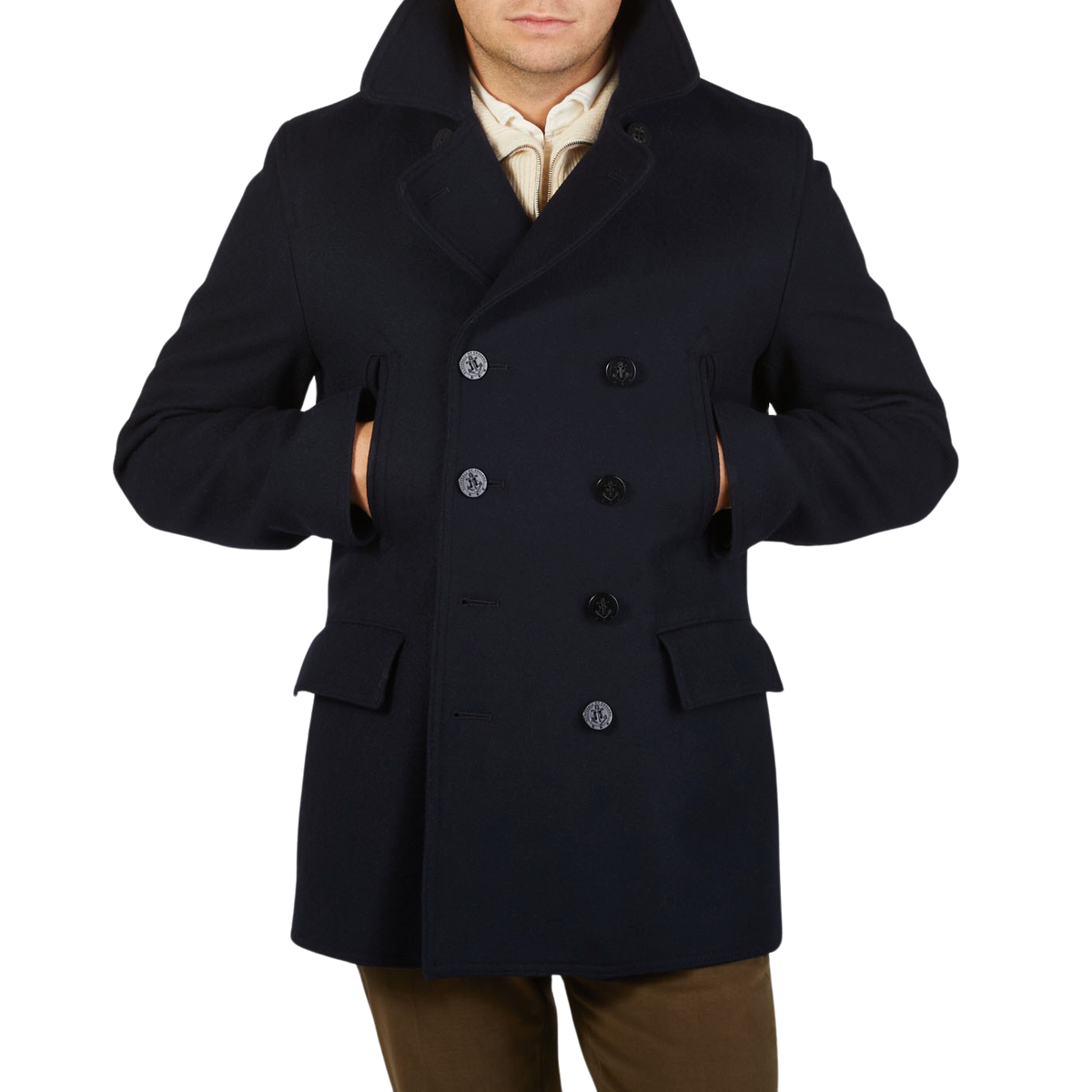 A man wearing a navy Gloverall Navy Wool Churchill Peacoat made of English Melton wool.