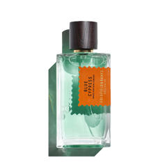 A 100ml Eau de Parfum glass bottle of Blue Cypress by Goldfield & Banks, showcasing a woody base with aromatic spices, topped with a wooden cap and containing a green-tinted liquid inside.