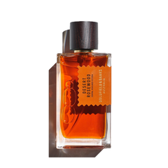 Goldfield & Banks' "Desert Rosewood 100ml Eau de Parfum" comes in a rectangular glass bottle with a dark wooden cap, conveying a luxurious woody fragrance.