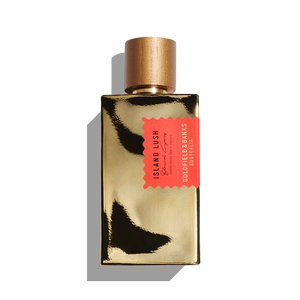 A gold bottle of Goldfield & Banks Island Lush 100ml Eau De Parfum, adorned with a red tag, is set against a white background, embodying the exoticism of contemporary woods and the captivating essence of South Pacific Sandalwood.