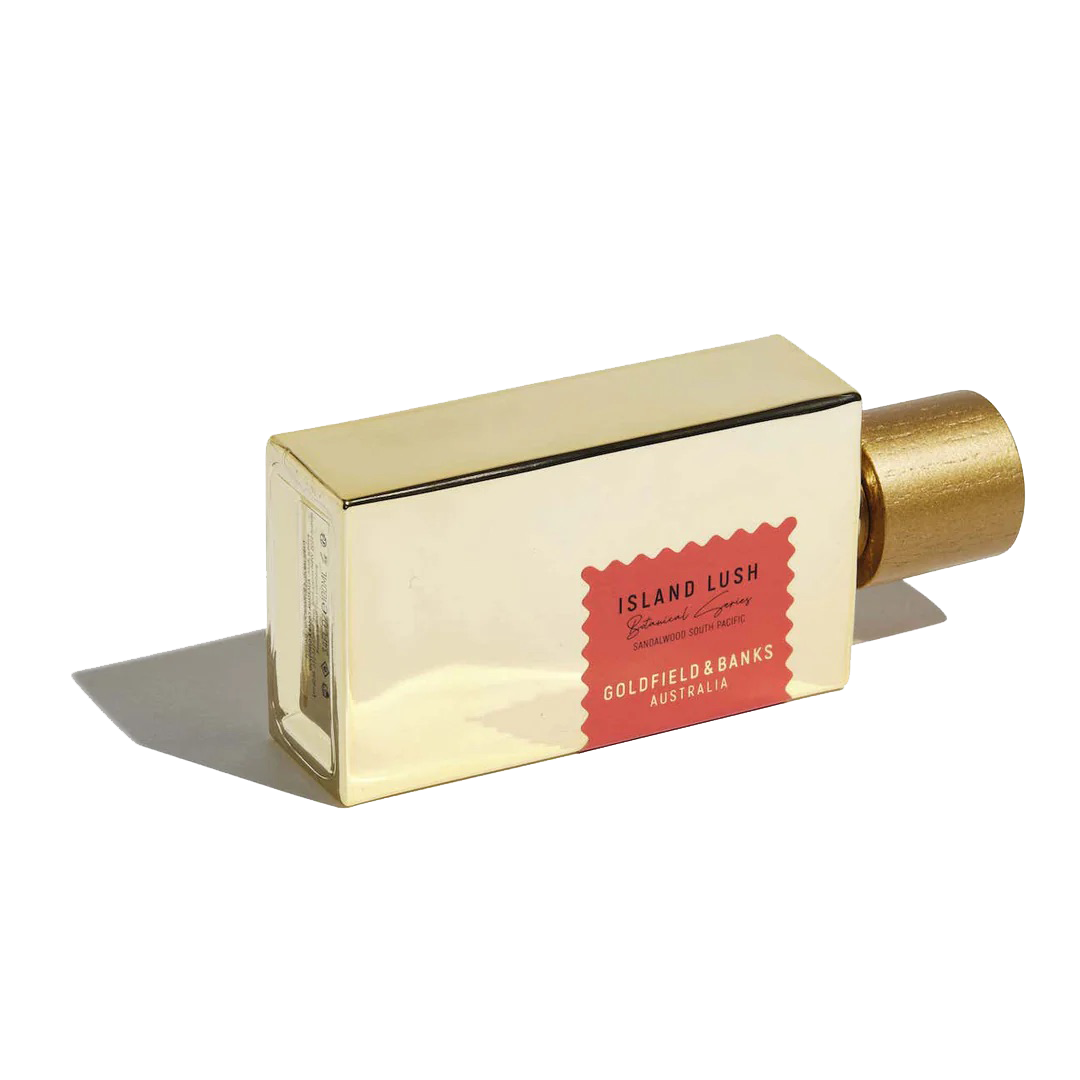 A rectangular gold bottle of "Island Lush" 100ml Eau De Parfum from Goldfield & Banks, featuring a red accent and exuding an exotic allure.