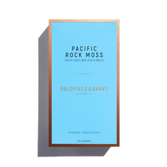 The "Pacific Rock Moss" 100ml Eau De Parfum by Goldfield & Banks, housed in a blue box with a bronze border, captures the fresh essence of sea spray scent.