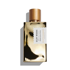 The Goldfield & Banks "Silky Woods 100ml Eau De Parfum" features a glistening golden cap and reflective surface, embodying elegance and allure.