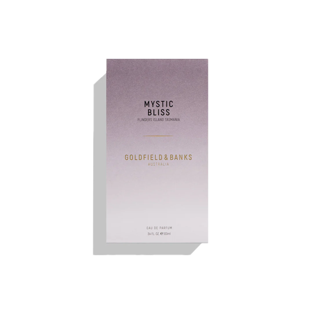 Box of Goldfield & Banks Mystic Bliss 100ml Eau De Parfum, featuring a gradient design with purple and white background text, draws inspiration from the mesmerizing hues of the Aurora Australis.