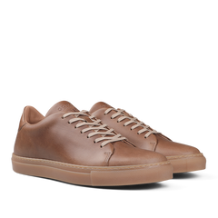 A pair of Goral's Brown Horween Leather Mellor II Sneakers featuring premium-quality leather, white laces, and tan rubber soles.