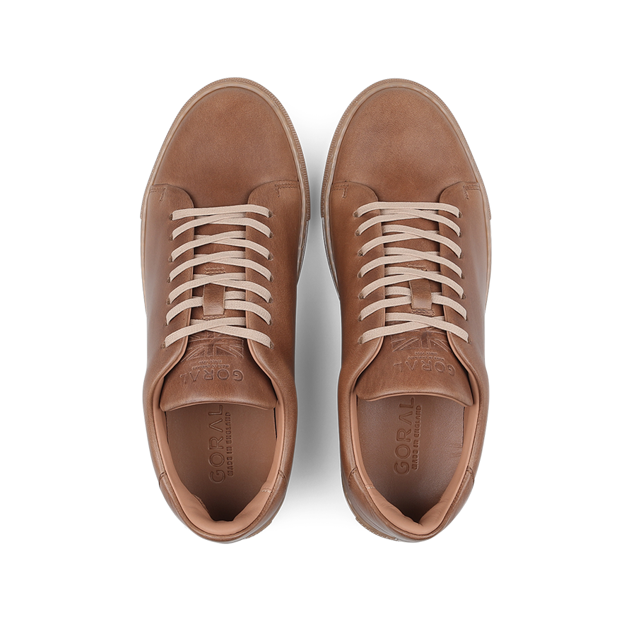 Goral's Brown Horween Leather Mellor II Sneakers feature premium-quality brown leather and white laces, presented from an overhead view.