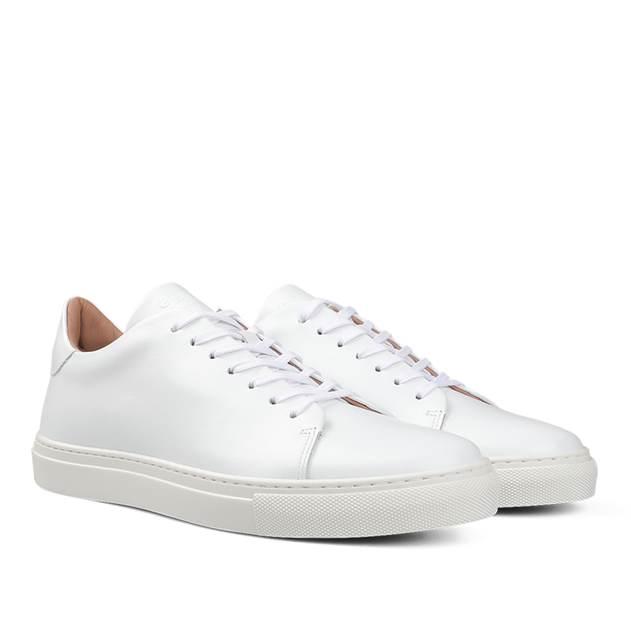 The White Calfskin Mellor II Sneakers by the renowned British brand Goral, featuring premium-quality white leather, white laces, and rubber soles, are showcased against a plain background.