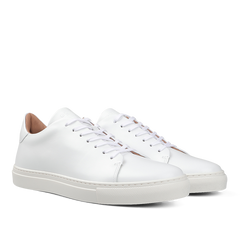 The White Calfskin Mellor II Sneakers by the renowned British brand Goral, featuring premium-quality white leather, white laces, and rubber soles, are showcased against a plain background.