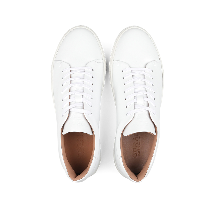 Pair of White Calfskin Mellor II Sneakers with white laces, viewed from above, showcasing the craftsmanship of the esteemed British footwear brand Goral.