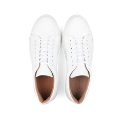 Pair of White Calfskin Mellor II Sneakers with white laces, viewed from above, showcasing the craftsmanship of the esteemed British footwear brand Goral.