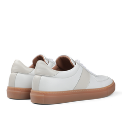 The White Leather Hadfield Sneakers by Goral feature beige accents and light brown rubber soles, viewed from the back and side, evoke the classic style of a German military trainer.