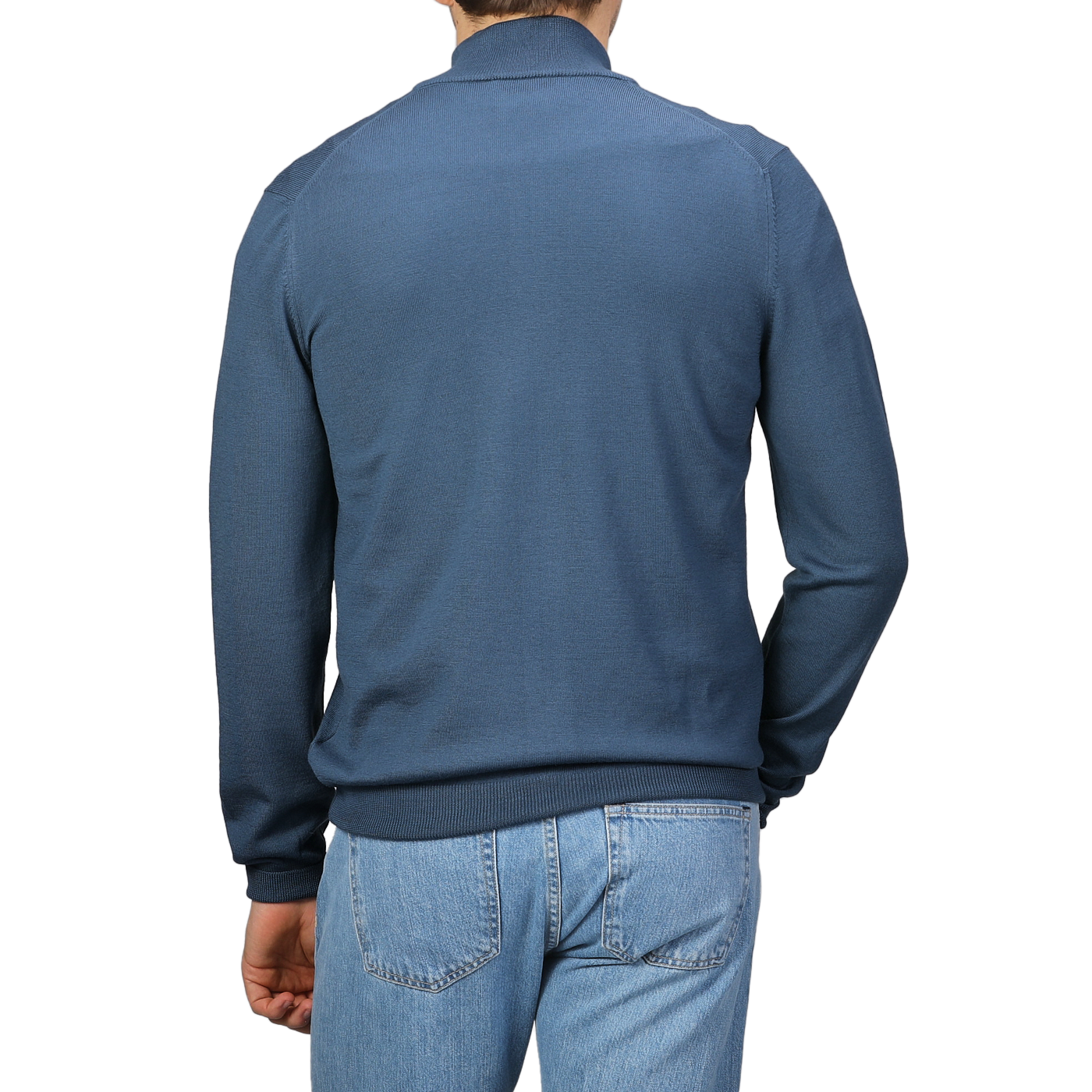 A person is seen from the back against a plain background, wearing an Airforce Blue Extrafine Merino Wool Zip Cardigan by Gran Sasso and light blue jeans.