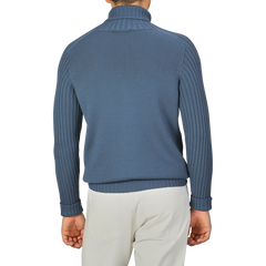 Person wearing a Gran Sasso Airforce Blue Rain Wool Rollneck and light-colored pants, shown from the back.