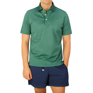 A man wearing a Gran Sasso Aqua Green Cotton Filo Scozia Polo Shirt and shorts.