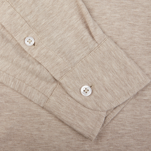 Close-up of a Gran Sasso beige cotton jersey popover shirt cuff with buttons.