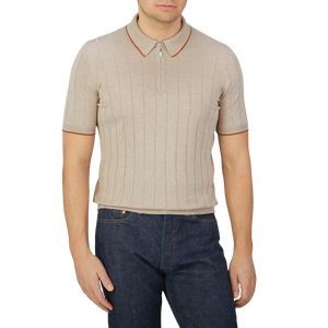 A man wearing a Gran Sasso Taupe Beige Knitted Silk Zip Polo Shirt.