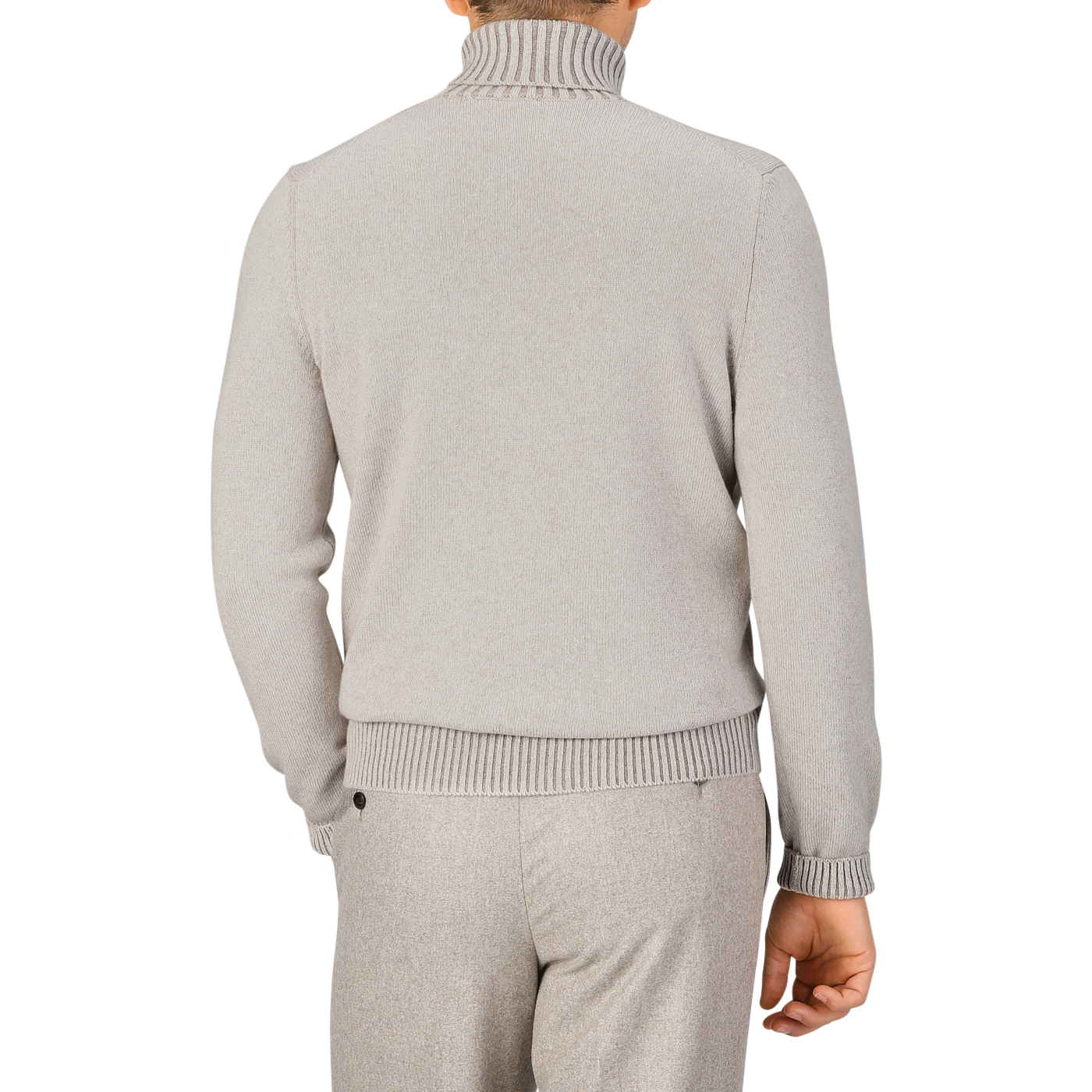 A person is seen from the back, dressed in a beige melange Gran Sasso Pure Cashmere Rollneck sweater and matching pants.