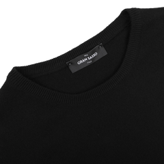 Indulge in the luxury of pure cashmere with the Black Cashmere Crewneck Sweater by Gran Sasso, where the brand label is elegantly displayed at the neckline. This sophisticated piece embodies sustainable knitwear, merging style with responsibility.