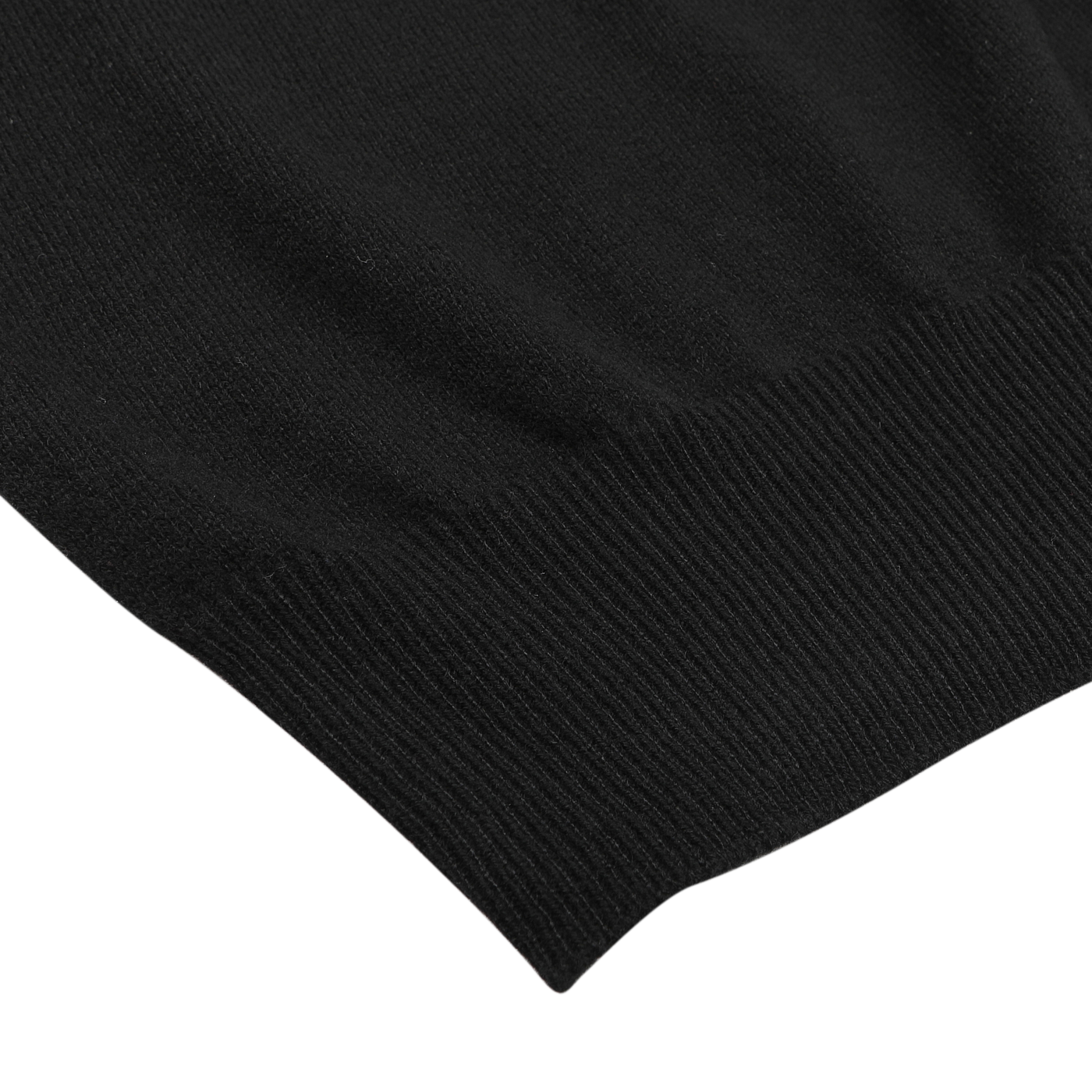 Detailed view of the hem of a Gran Sasso Black Cashmere Crewneck Sweater, crafted entirely from pure cashmere, set against a white background.