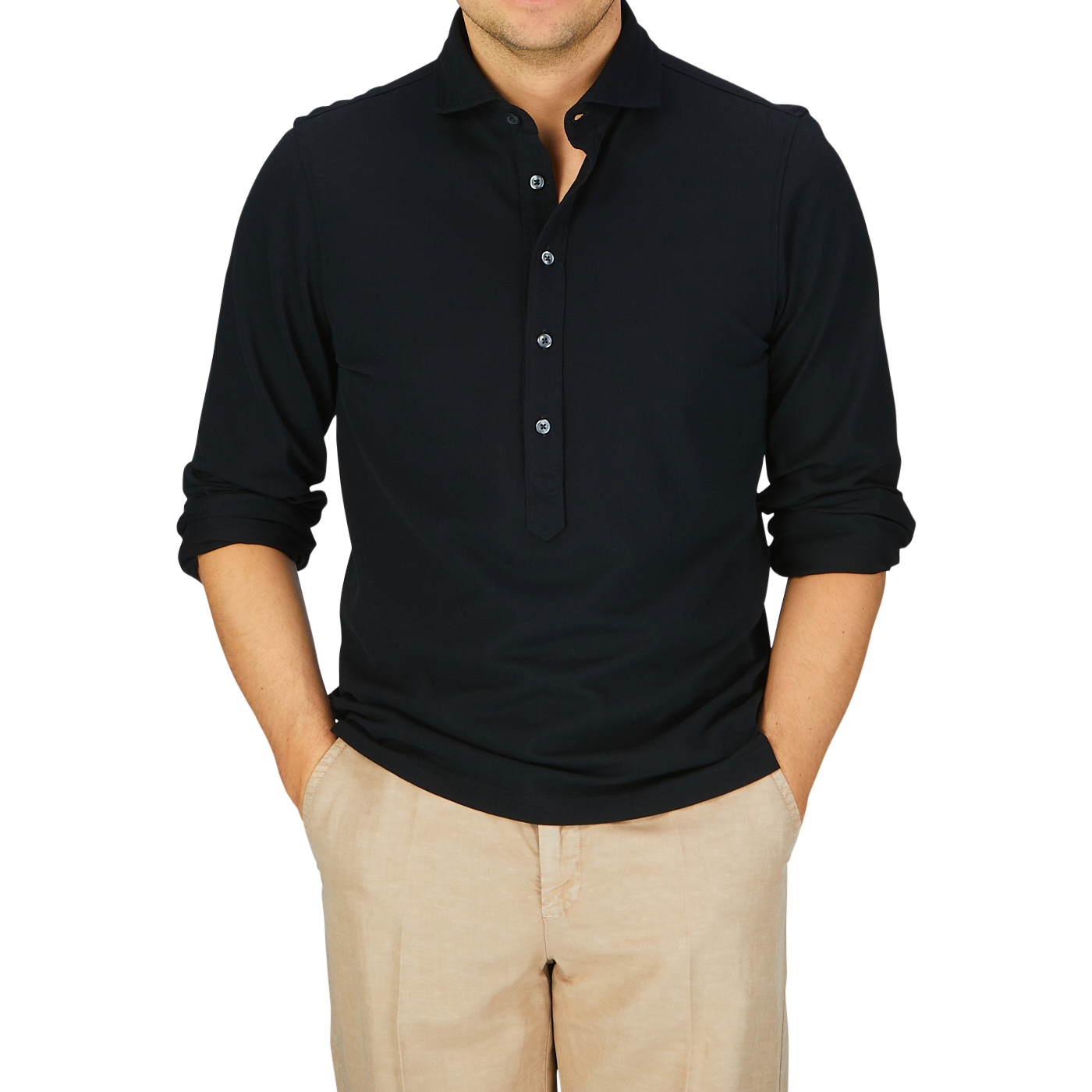 Man wearing a slim fit Gran Sasso black cotton jersey popover shirt and beige trousers.