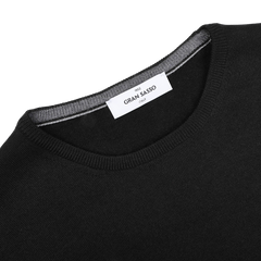 The Gran Sasso Black Extra Fine Merino Crew Neck sweater features a classic design and a visible inside collar label, making it the perfect match for your favorite selvage denim for a timeless look.