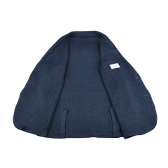 The Blue Melange Linen Cotton Knitted Blazer by Gran Sasso is displayed flat, showcasing its inner lining and a small label on the right side.