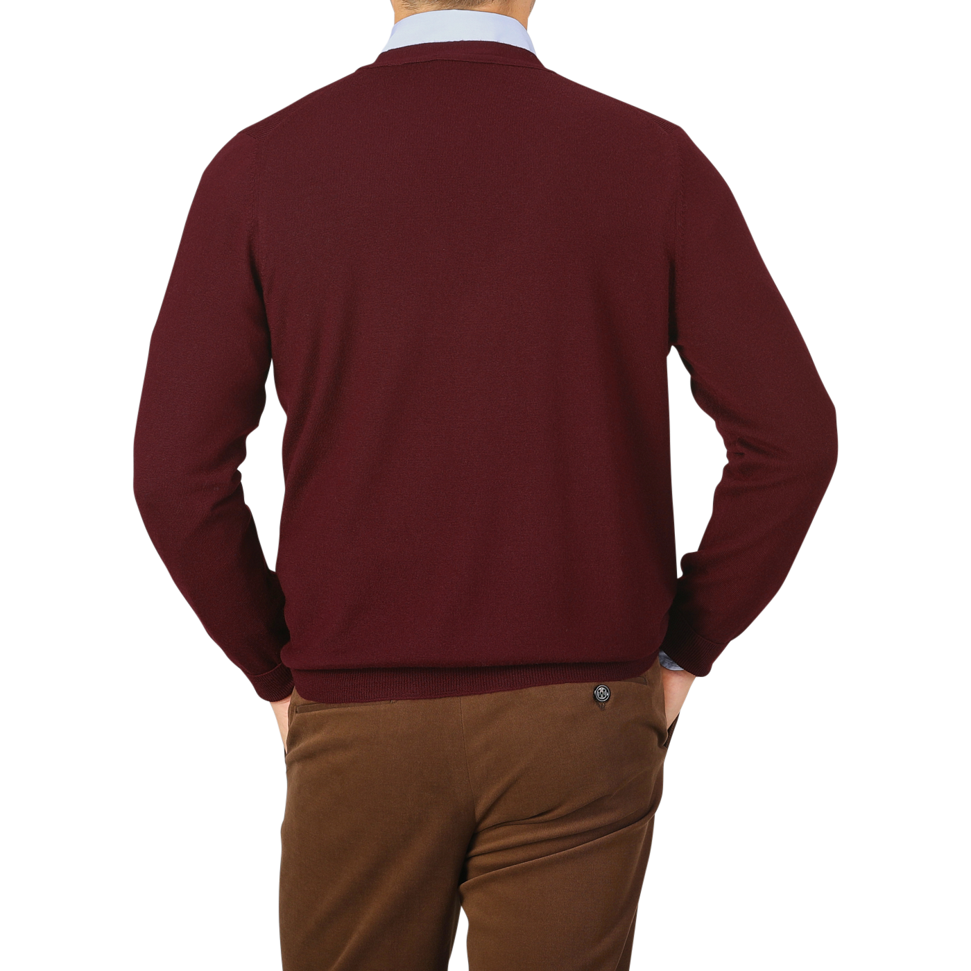 Man in brown pants and a Gran Sasso Bordeaux Extra Fine Merino Wool Cardigan, facing away from the camera, holding his hands behind his back against a plain background. The pure merino wool and mother of pearl buttons add subtle elegance to his attire.