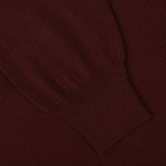 Close-up of a Gran Sasso Bordeaux Extra Fine Merino Wool Cardigan sleeve with a ribbed cuff.