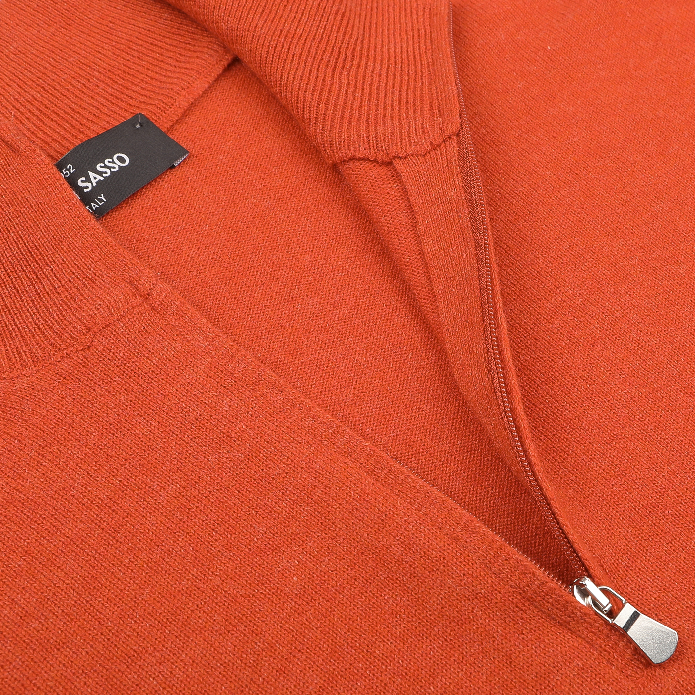 Close-up of the Gran Sasso Bright Orange Cashmere 1/4 Zip Sweater, featuring a visible black label on the collar. This luxurious sweater exemplifies the fine craftsmanship associated with Gran Sasso.